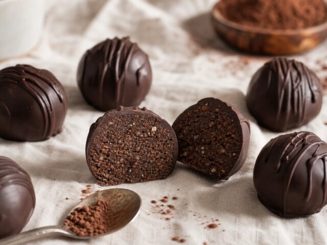 Dark chocolate protein truffles, one cut in half