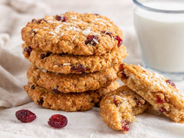 Coconut cranberry breakfast cookies, one broken in half