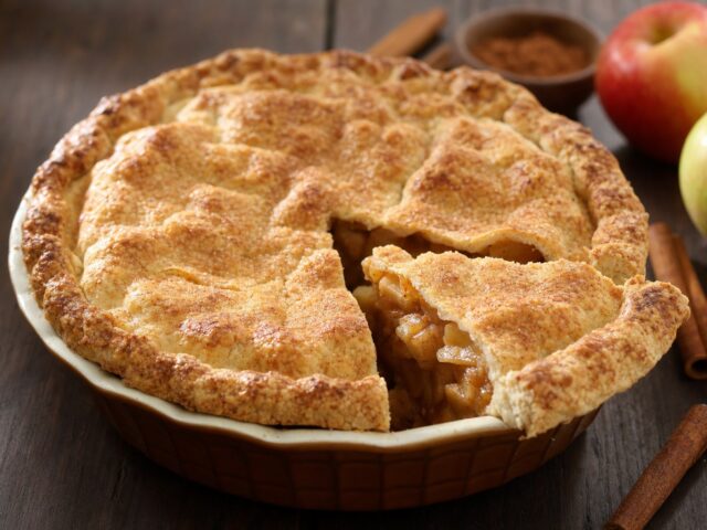 A slice of gluten-free sugar-free apple pie cut from the whole pie